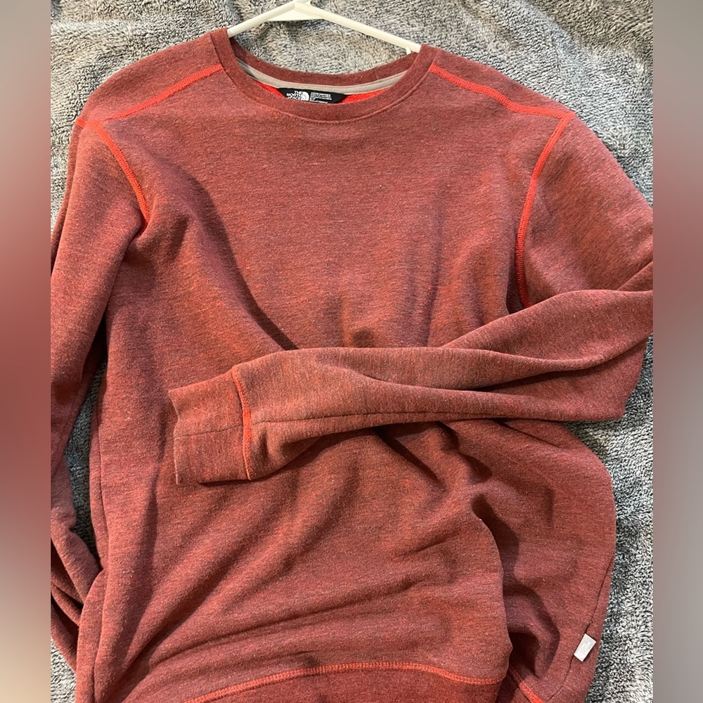North face sweatshirt. Size small fits more like M. Very warm.